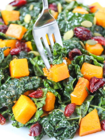 Butternut Squash Kale Salad with fork piercing the salad