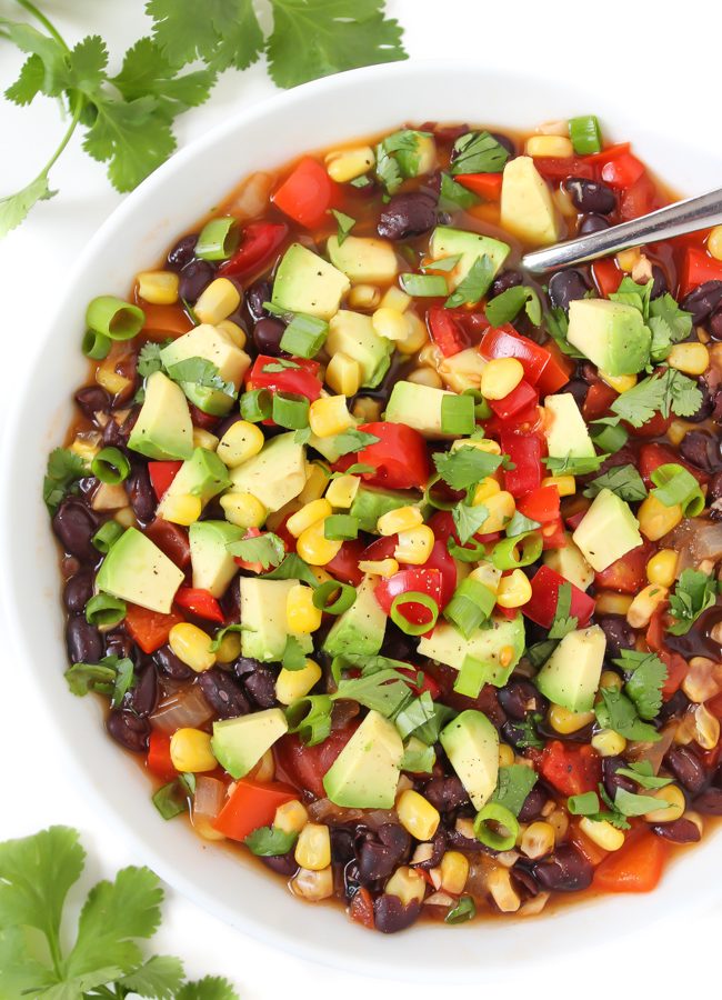 Bowl of vegan southwest black bean soup with avocado