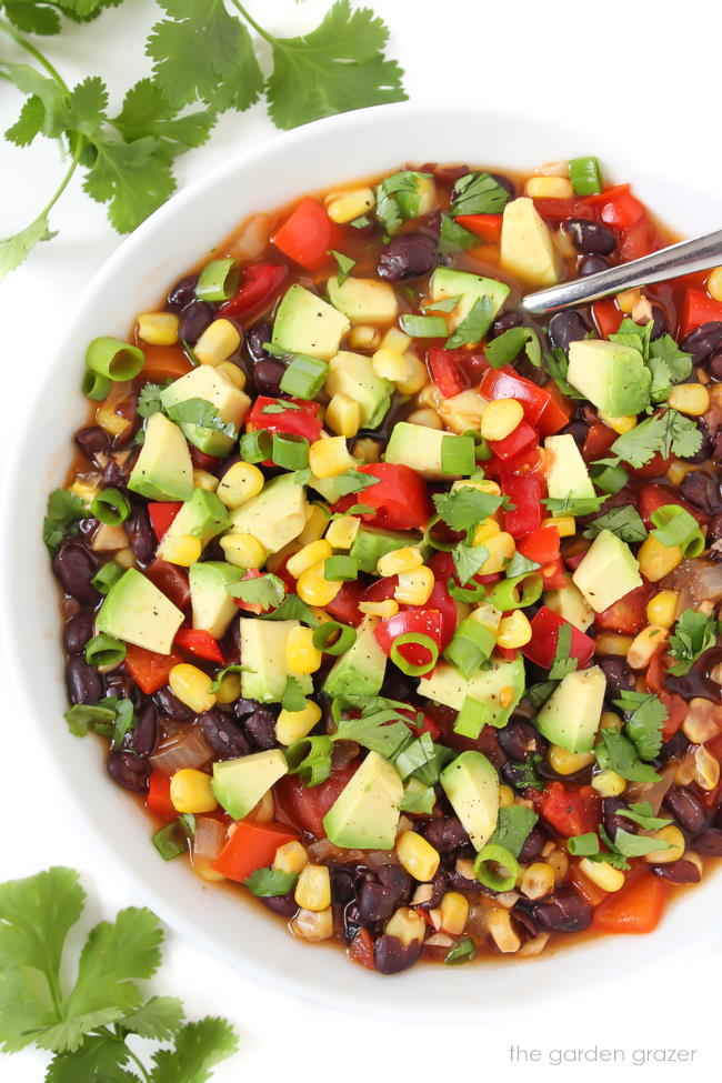 Bowl of vegan southwest black bean soup with avocado