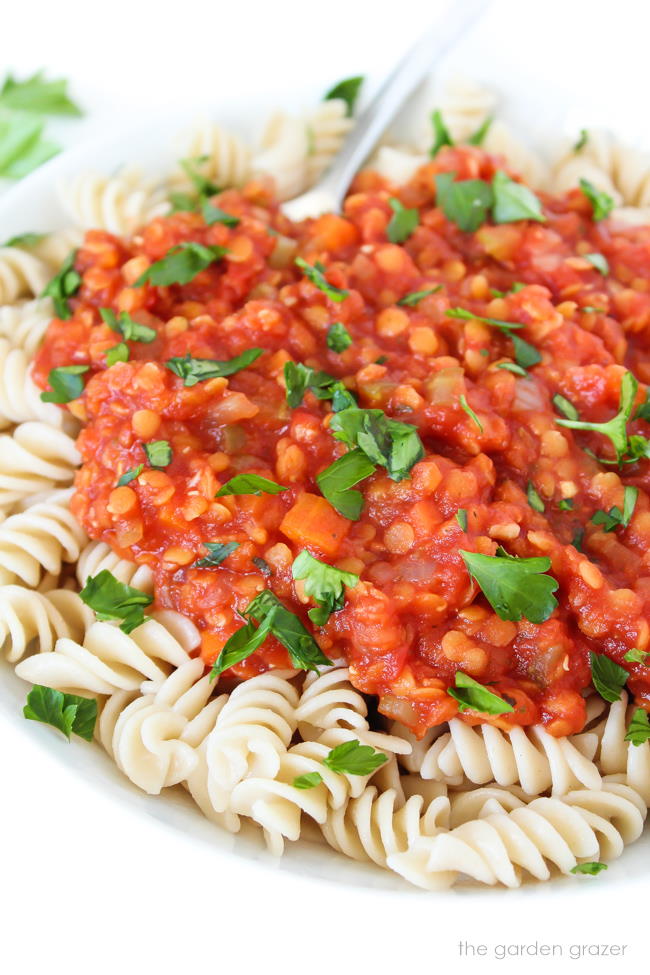 Bowl of pasta with vegan lentil bolognese sauce on top