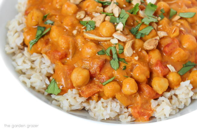 Vegan Butter Chickpeas in a bowl with rice and cilantro