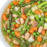 Bowl of vegan Spring Minestrone soup with fresh dill