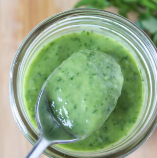 Creamy vegan garden herb dressing in a jar