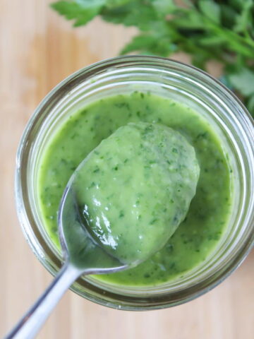Creamy vegan garden herb dressing in a jar