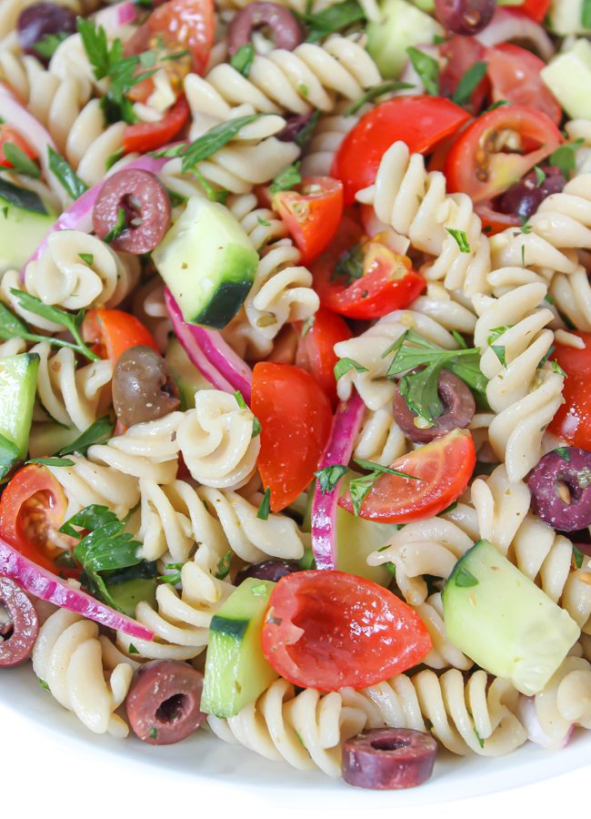 Vegan Pasta Salad in a bowl with tomatoes and cucumber