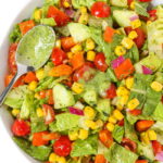 Plate of summer chopped salad tossed in creamy herb dressing