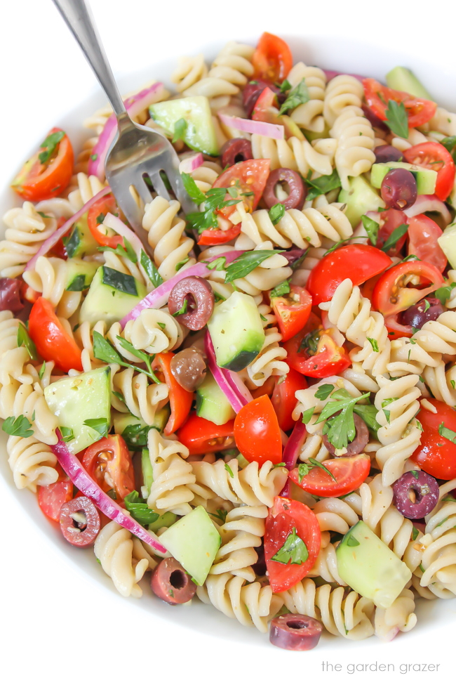 Vegan Italian Pasta Salad in a white bowl with fork