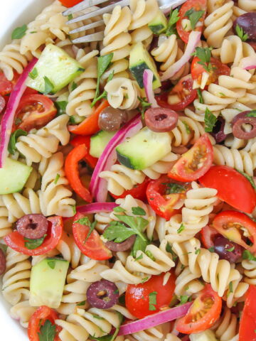 Vegan Italian-style pasta salad with oil-free dressing in a white bowl