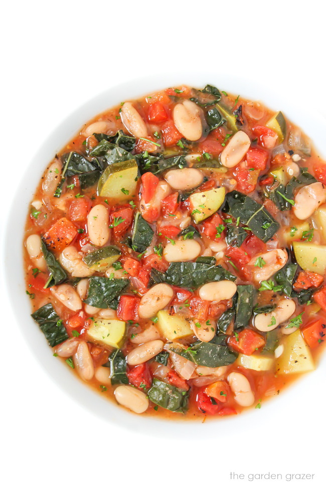 Cooked cannellini stew in a white bowl