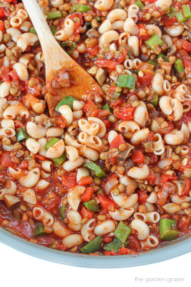 Skillet of vegan American goulash with lentils and mushrooms