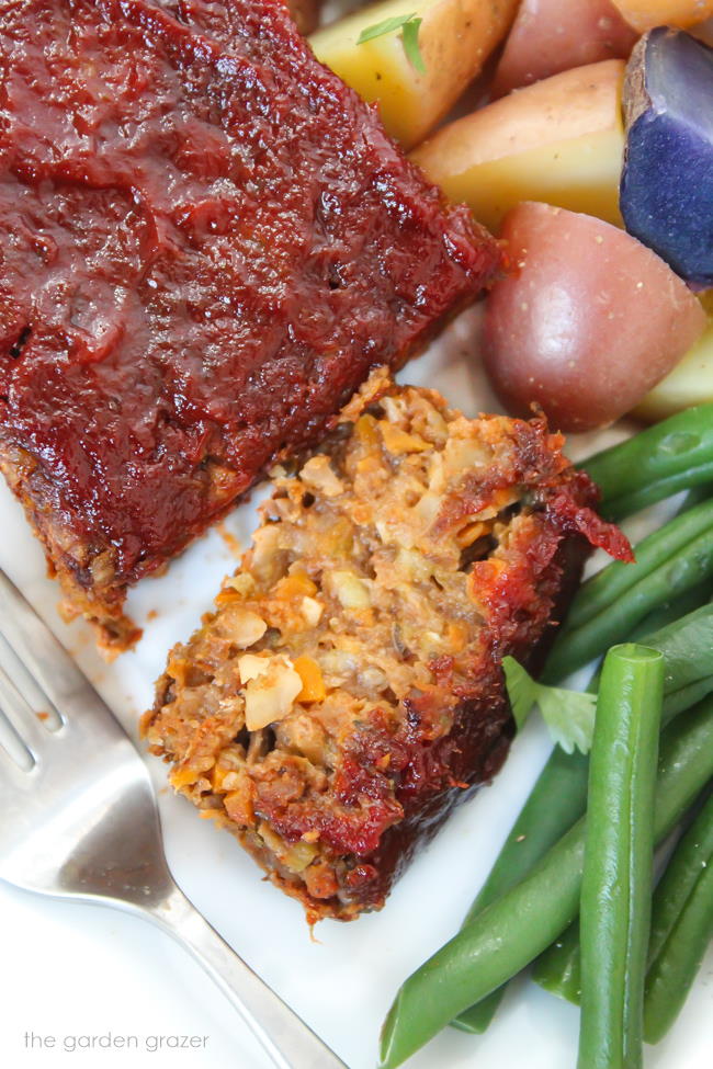 Sliced vegan lentil loaf on a plate