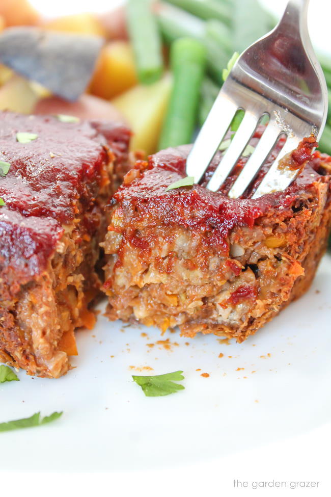 Vegan mini meatloaf on a plate with fork