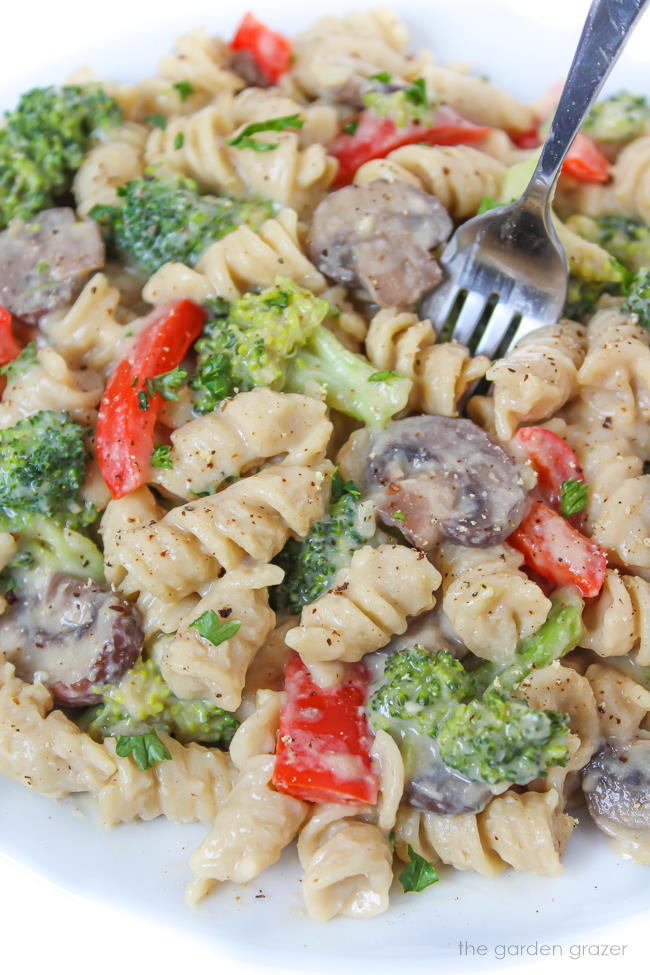 Vegan creamy garlic pasta with broccoli on a plate