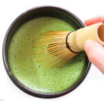 Whisking a hot bowl of matcha green tea