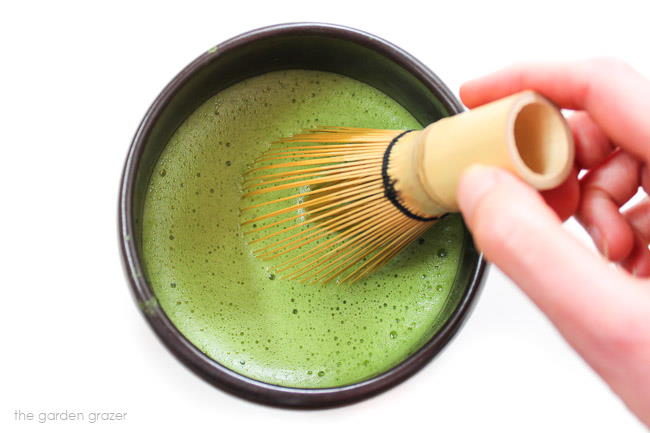 Whisking a hot bowl of matcha green tea