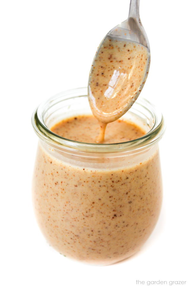 Vegan creamy southwestern-style dressing in a small jar with spoon