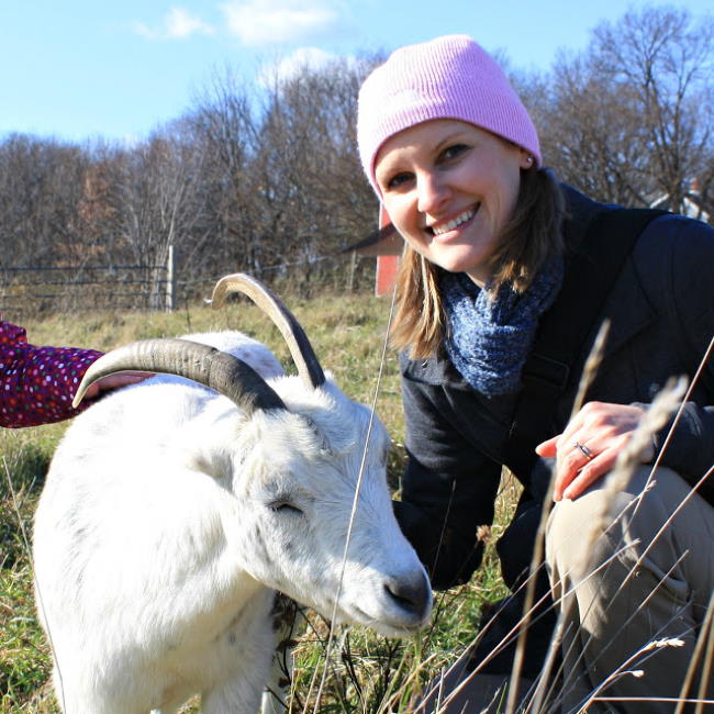 Kaitlin with goat at Heartland Farm Sanctuary in Madison Wisconsin