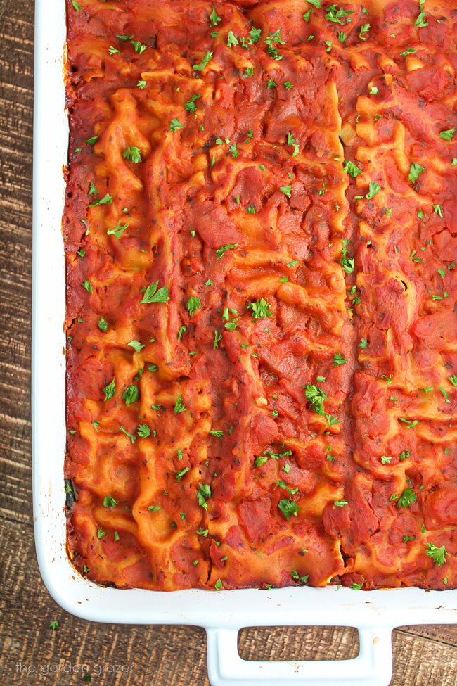 Baked vegan gluten-free zucchini lasagna in a large white casserole dish