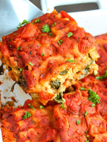 Vegan gluten-free lasagna in a white baking dish