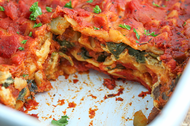 White casserole dish with baked vegan lasagna