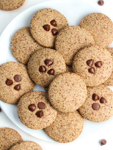 Almond flour cookies with cinnamon on a white plate