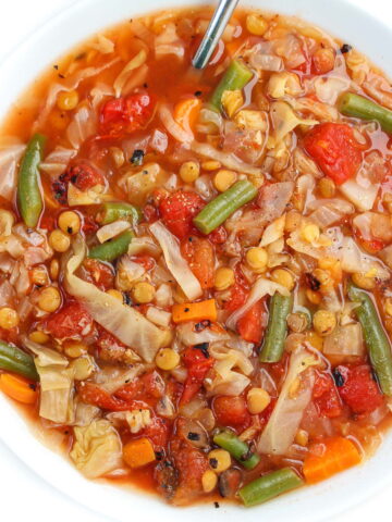 Lentil cabbage soup in a white bowl