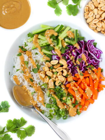 Vegan spring roll in a bowl with rice noodles and peanut sauce