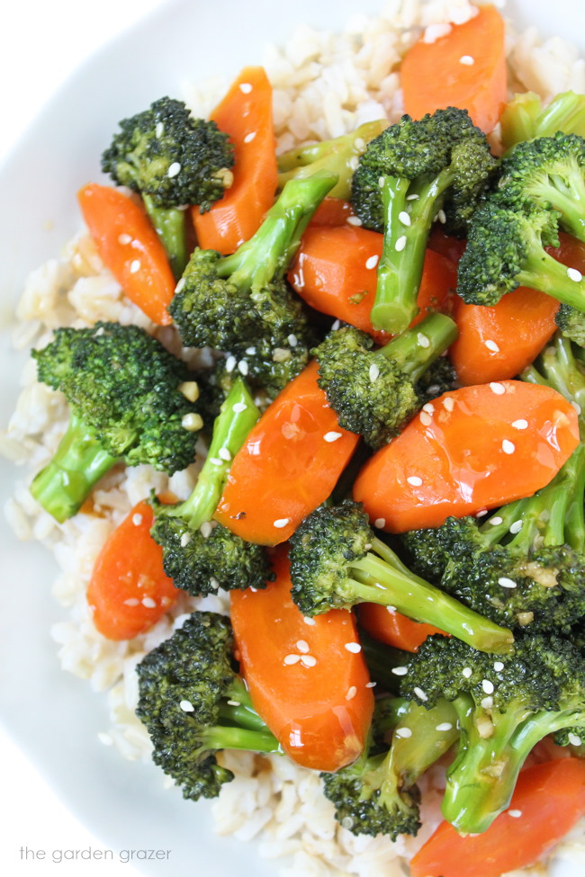 Vegan teriyaki broccoli with rice on a white plate