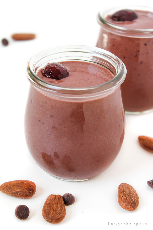 Vegan chocolate cherry almond smoothie in a small glass