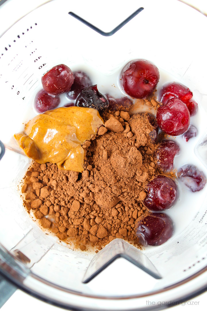 Preparing smoothie ingredients in a blender before blending