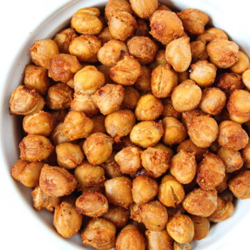 Overhead view of crispy smoky roasted chickpeas in a white bowl