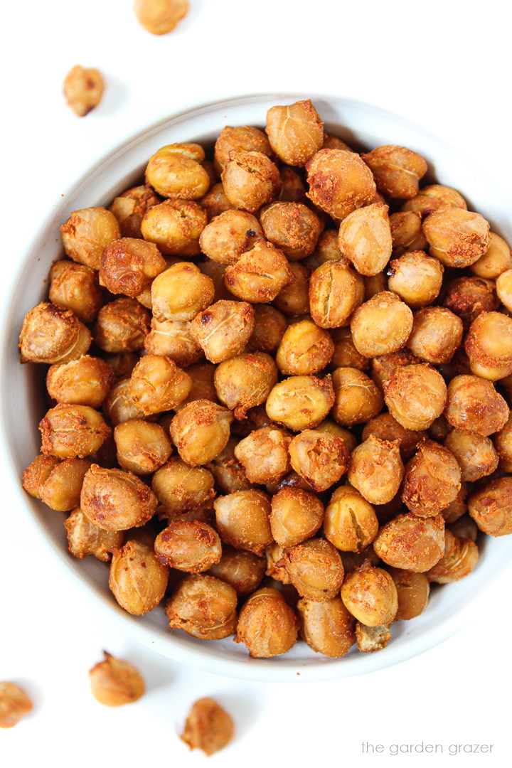 Overhead view of crispy smoky roasted chickpeas in a white bowl
