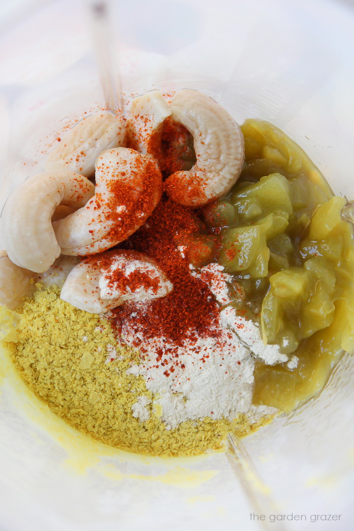 Overhead view of ingredients for cashew queso in a blender before mixing