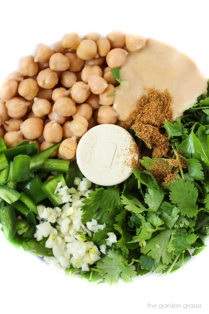 Overhead view of fresh ingredients in a food processor before blending