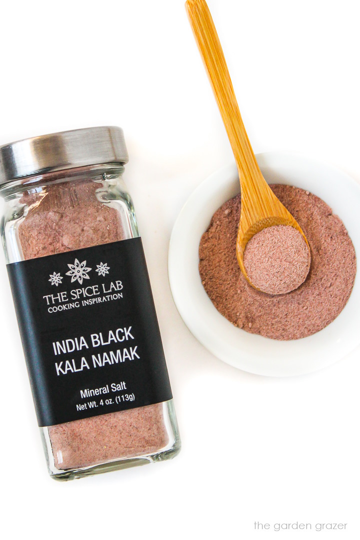 Kala namak spice bottle on a white table