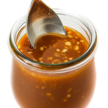Vegan stir fry sauce with garlic and ginger in a small glass jar