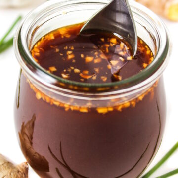 Close up view of prepared vegan stir fry sauce in a glass jar