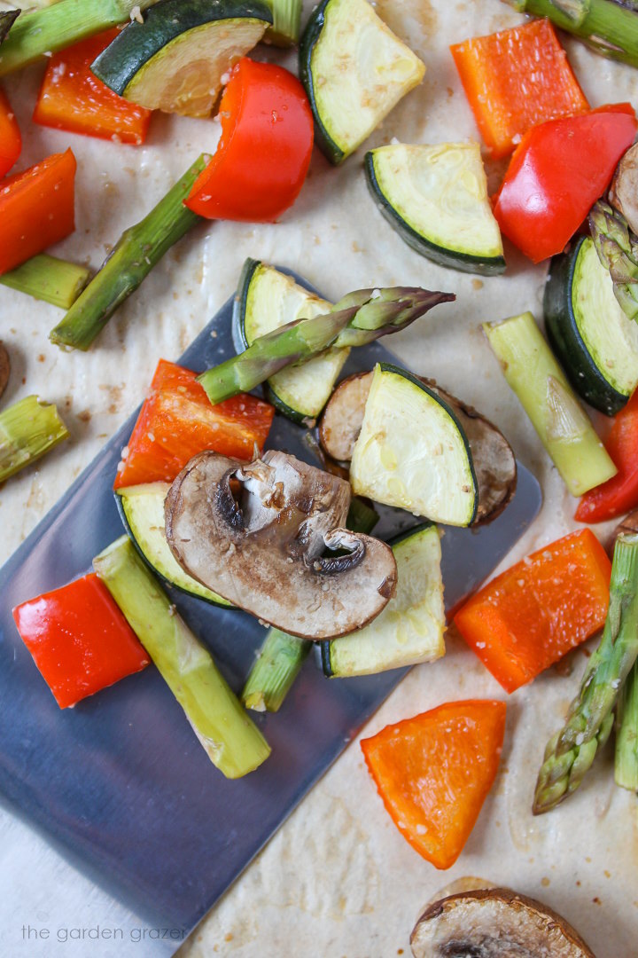 Mushrooms, asparagus, bell pepper, and zucchini roasted on a baking sheet