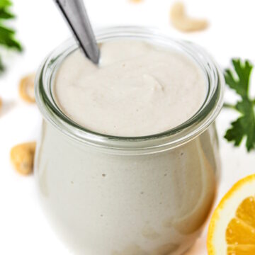 Vegan cashew mayo in a small jar with spoon