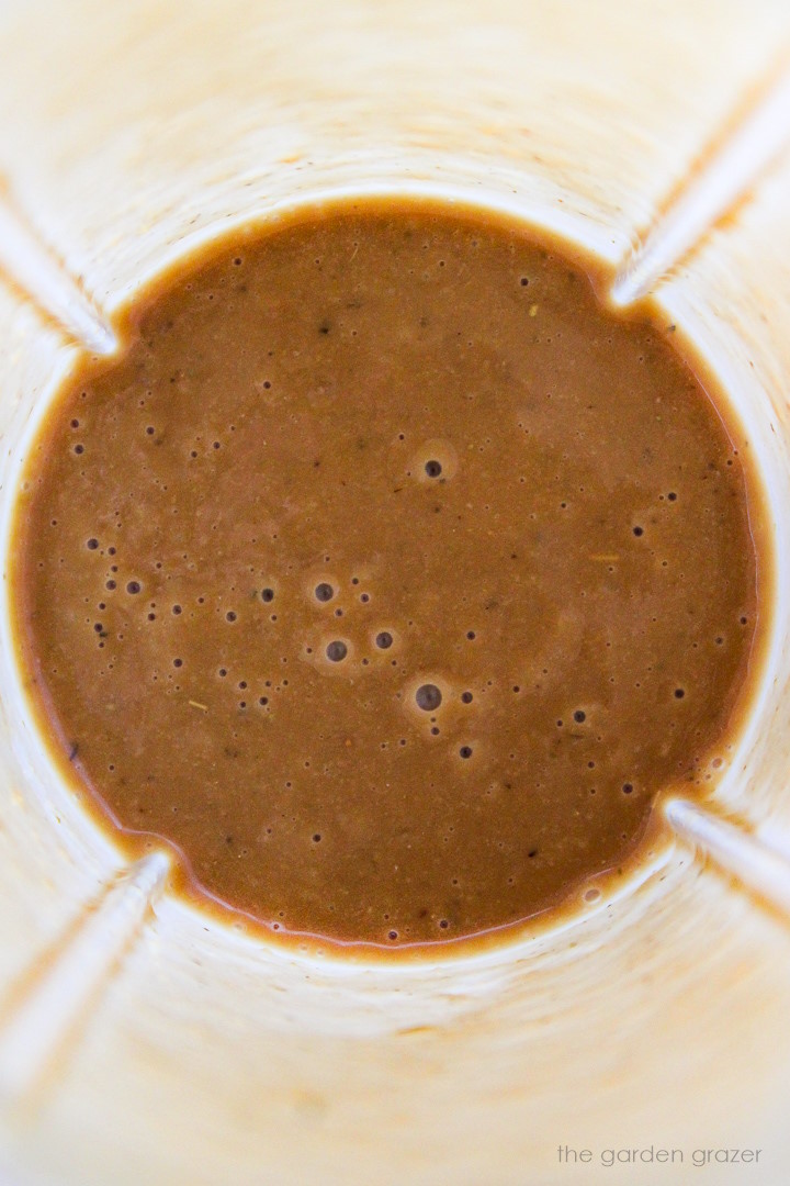 Overhead view of dressing in a blender cup after blending
