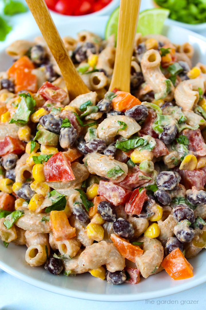 Close up view of vegan Mexican macaroni salad served in a white bowl