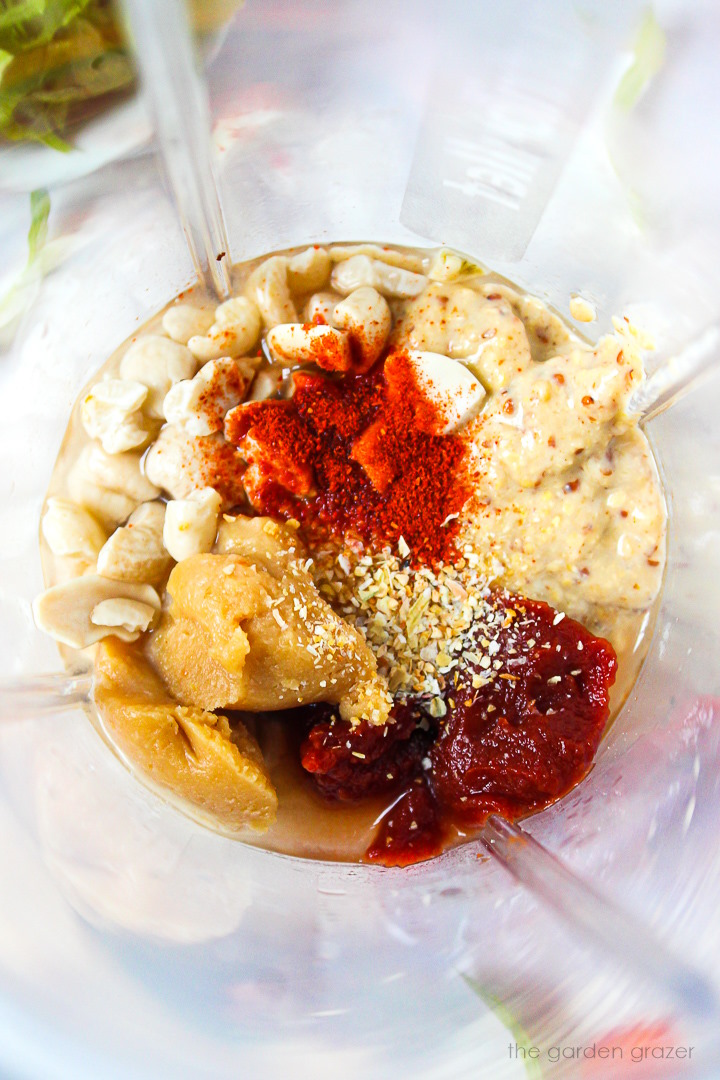 Overhead view of ingredients in a small blender cup before blending