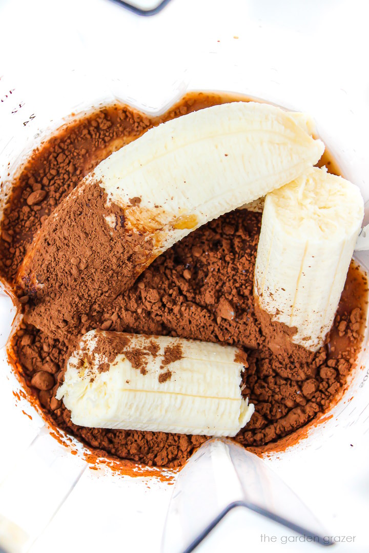 Overhead view of popsicle ingredients in a blender before blending