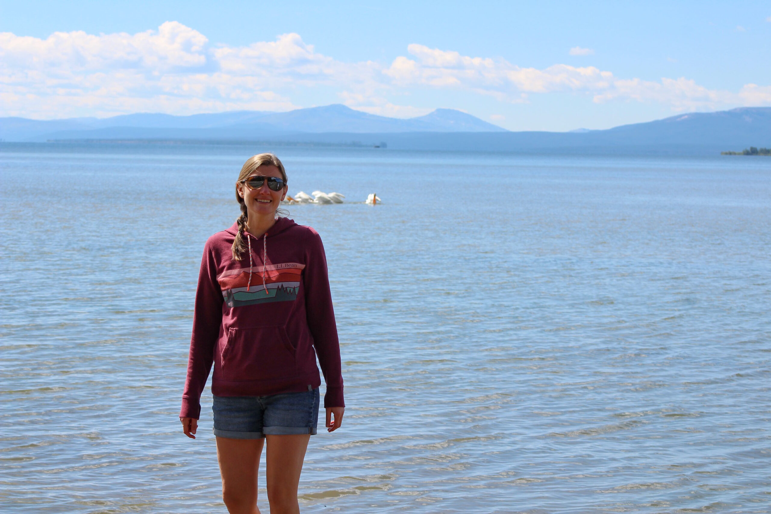 Kaitlin standing in front of Yellowstone Lake