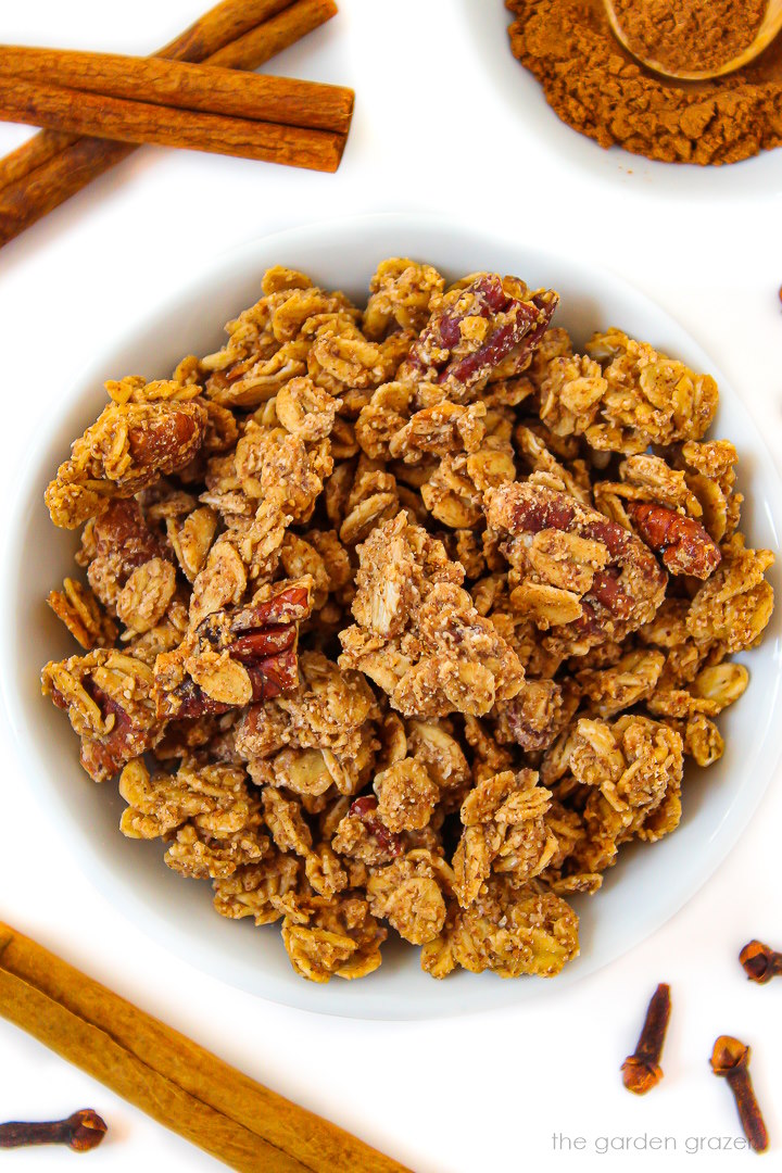 Overhead view of oil-free pumpkin pie spice granola in a white bowl