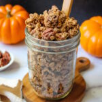 Pumpkin spice granola in a glass serving jar