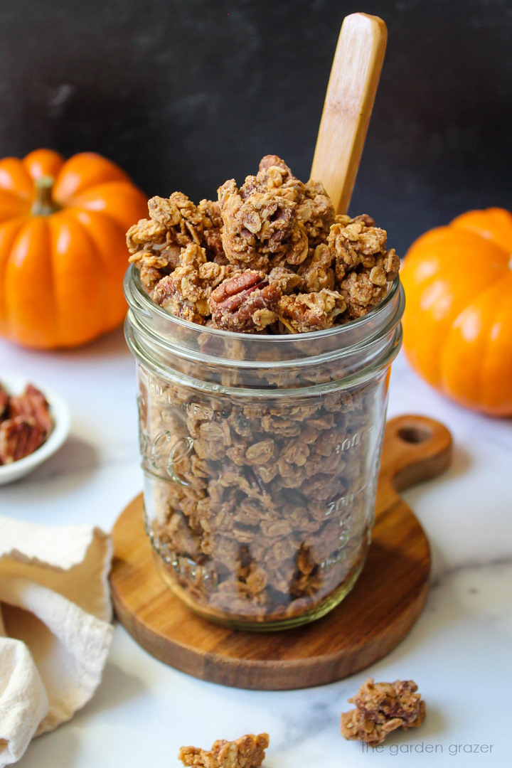 Pumpkin spice granola in a glass serving jar