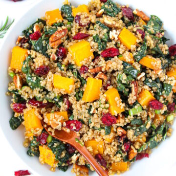 Fall harvest quinoa salad with kale and butternut squash in a white bowl