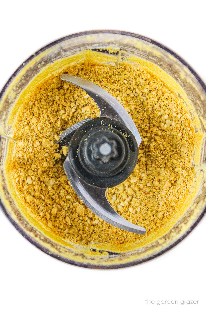 Overhead view of dairy-free cashew parmesan cheese after blending together in a food processor