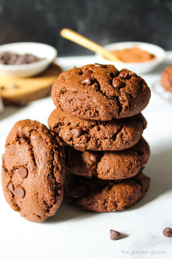 A stack of baked vegan chocolate cookies on a white table